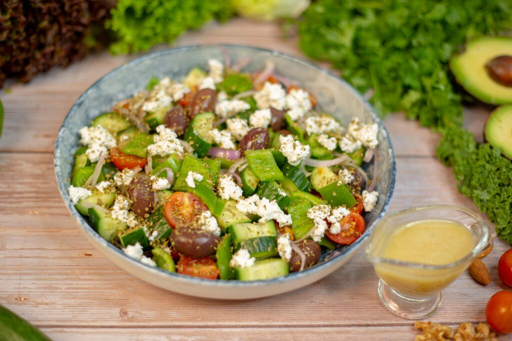 A vibrant Greek salad with fresh vegetables, feta cheese, and olives, perfect for a healthy meal.